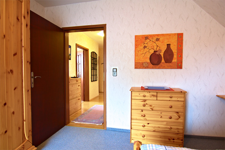 Ferienwohnung Dibbersen - großes Schlafzimmer